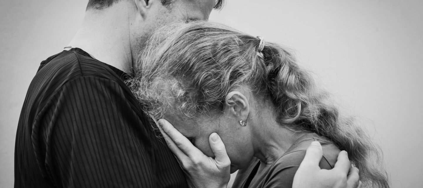 Sad,Woman,Hugging,Her,Husband